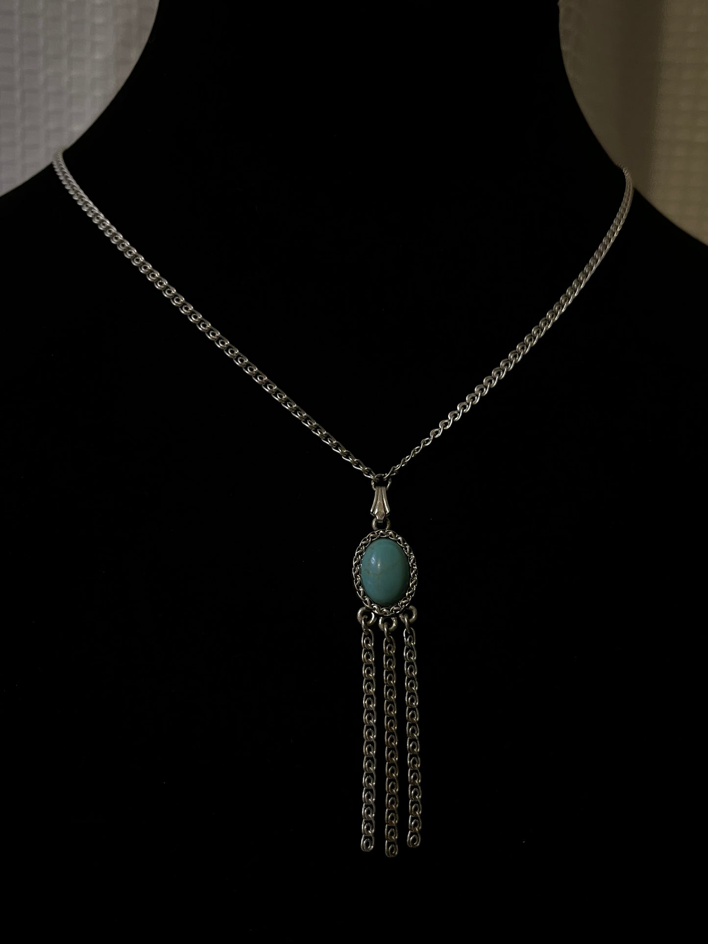 An antique silver pendant with turquoise and marcasite