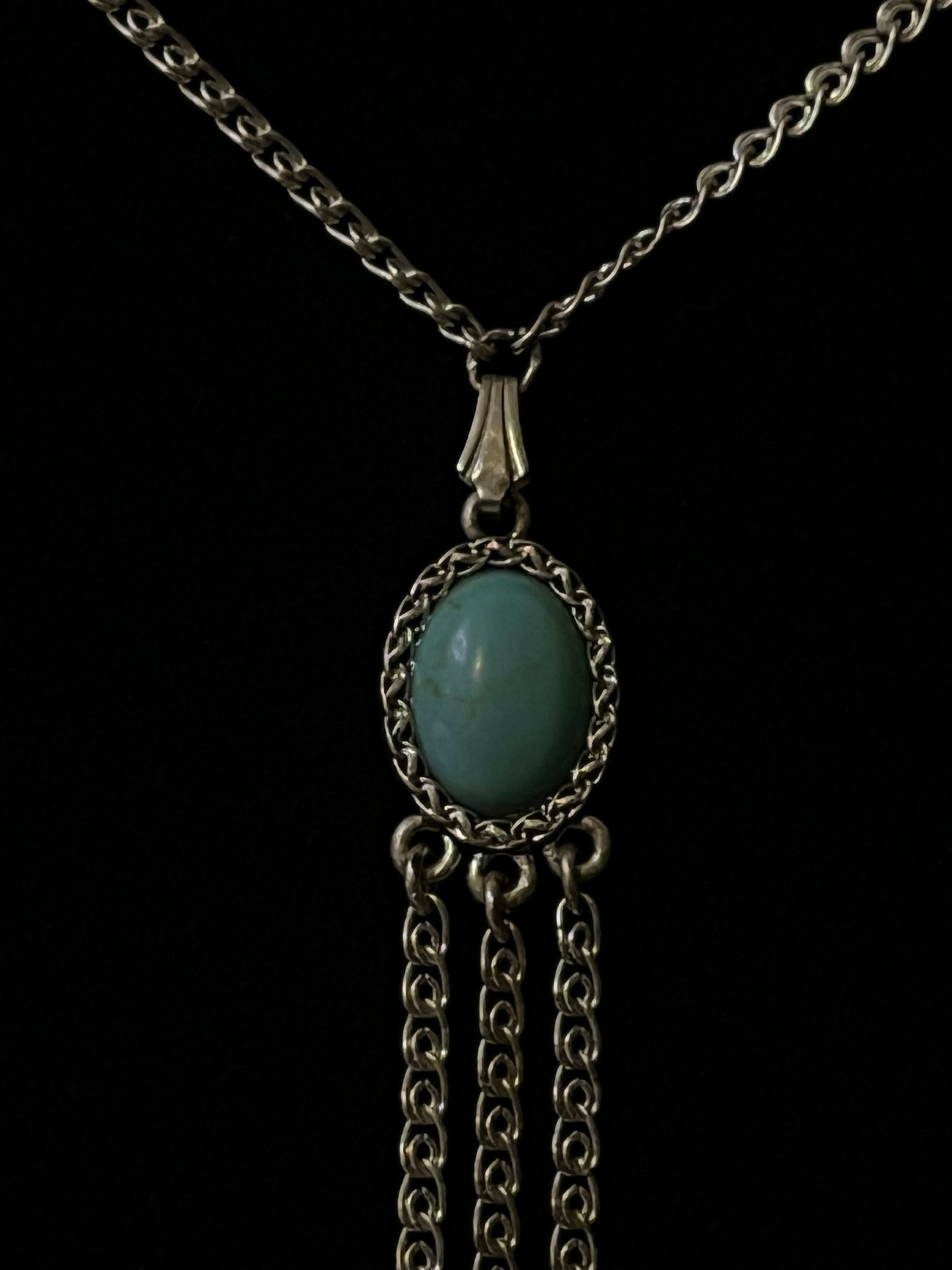 An antique silver pendant with turquoise and marcasite